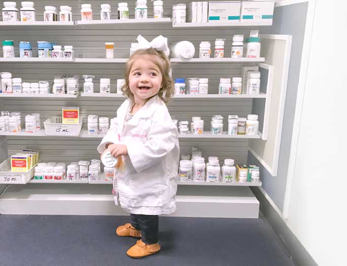 happy-little-girl-in-lab-coat